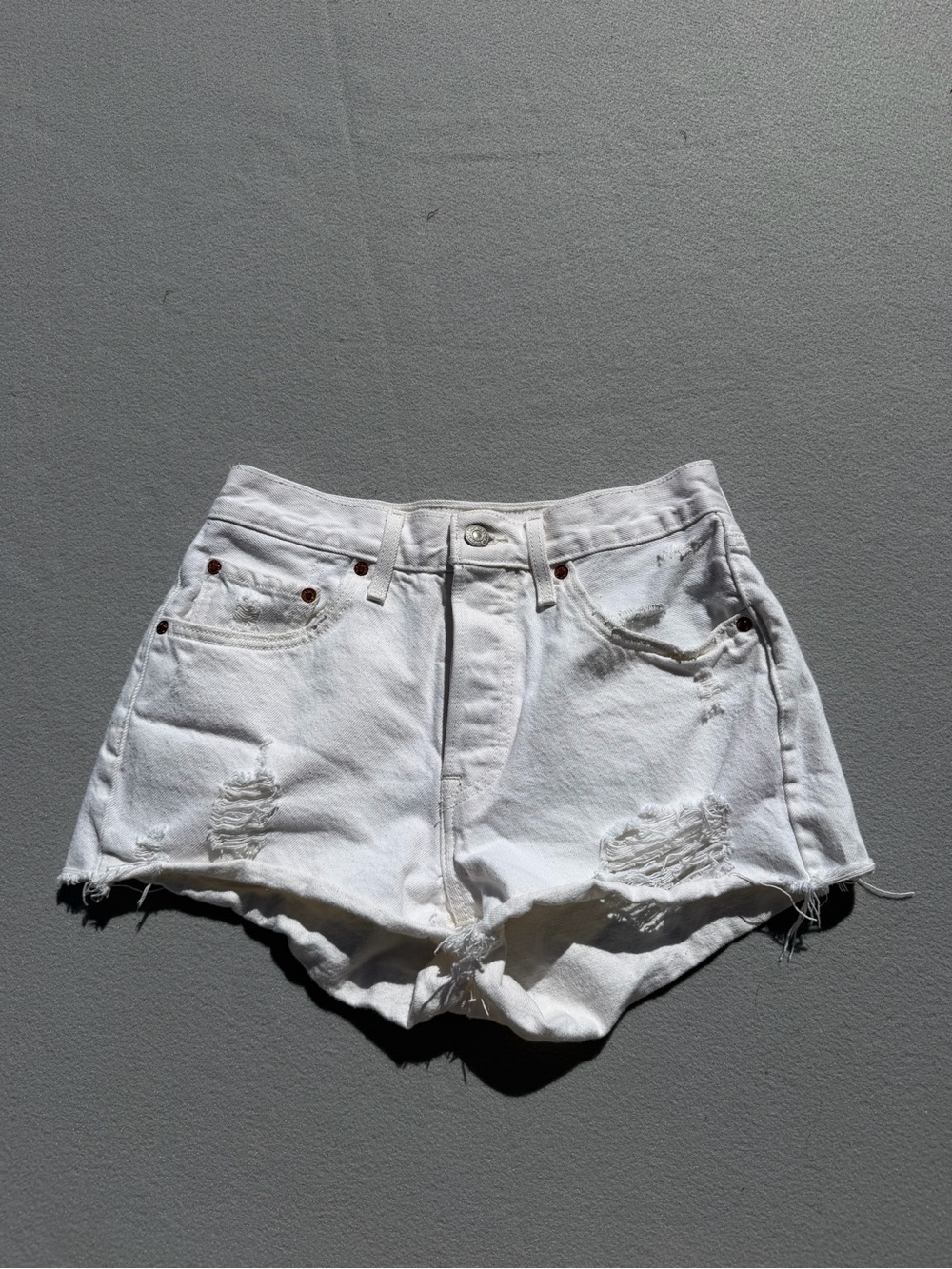 Levi’s High-Rise White Distressed Denim Shorts